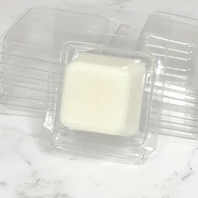a container of milk sitting on top of a marble counter