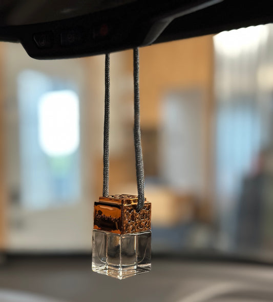 a piece of chocolate in a glass hanging from a hook