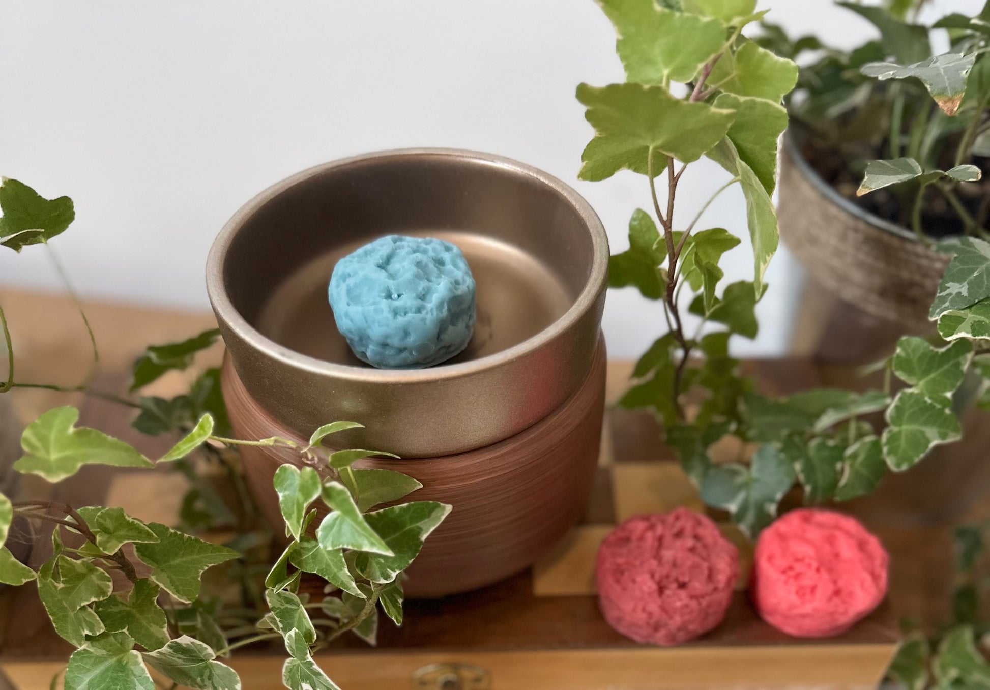 a metal container with a blue ball in it