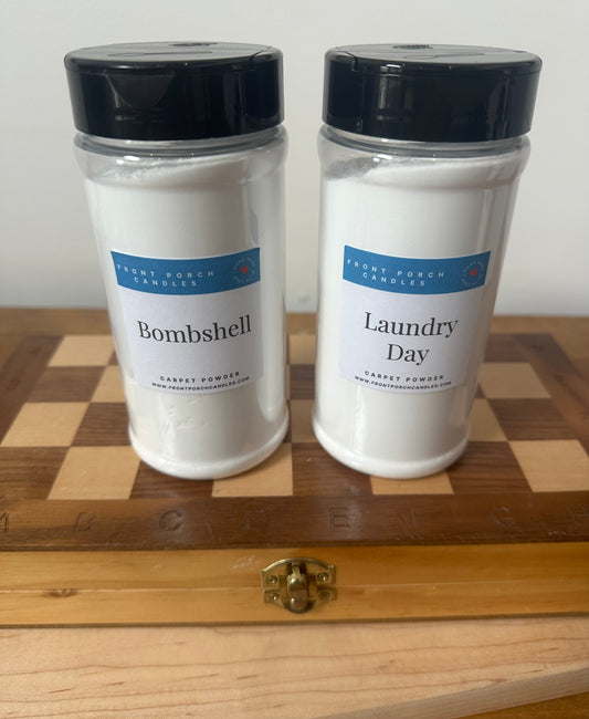 two jars sitting on top of a wooden board