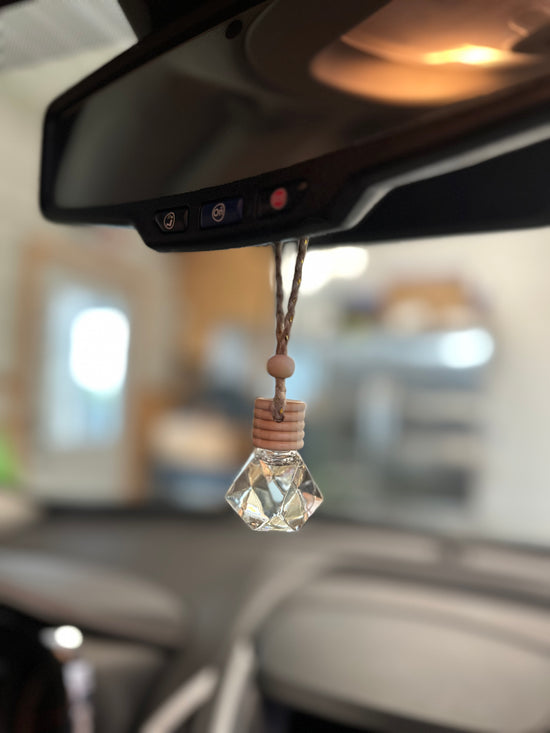 a close up of a car's dashboard with a light bulb hanging from the