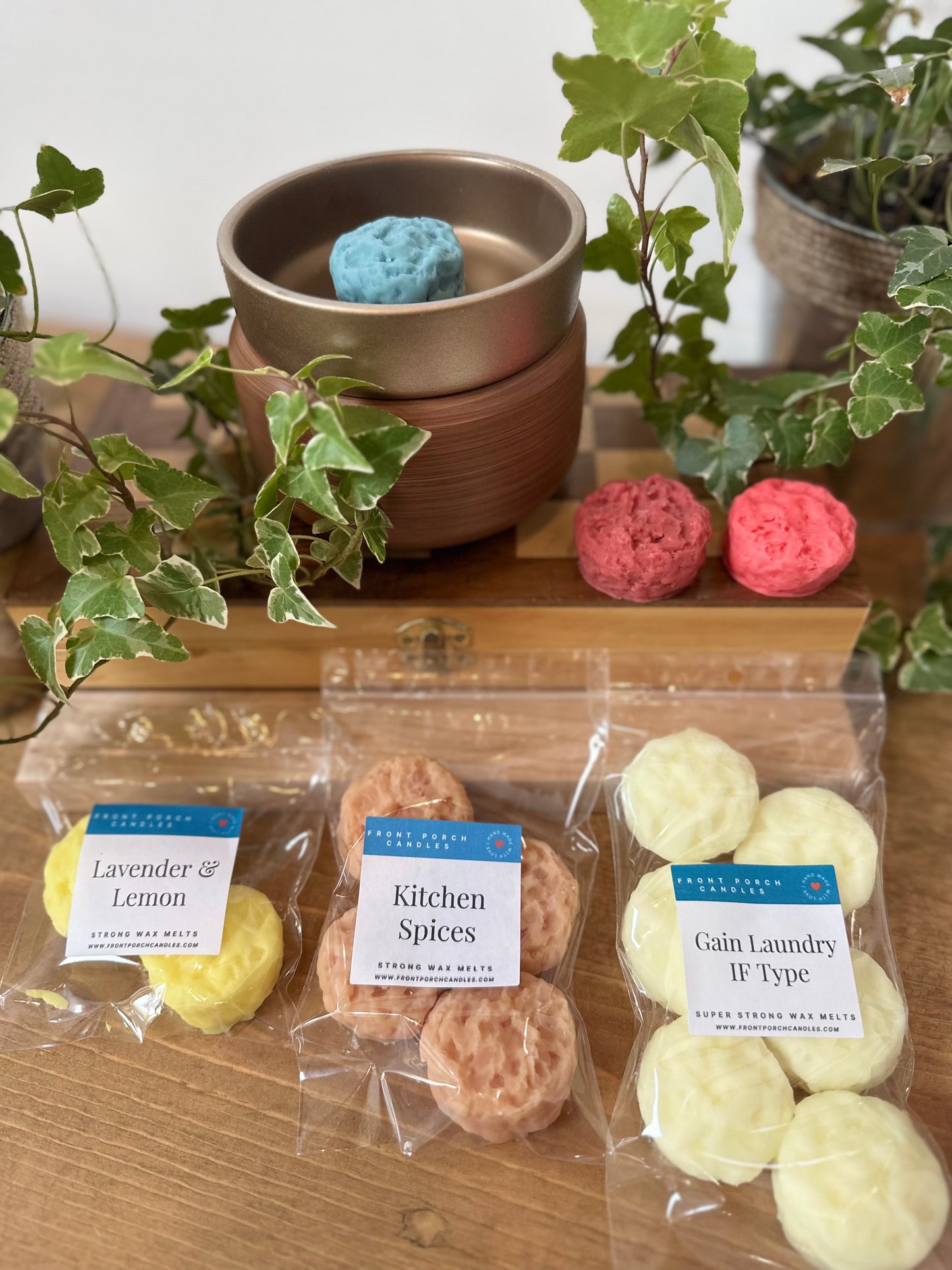 a wooden table topped with three bags of cookies